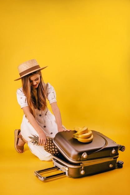 A beautiful young girl with long hair planned a trip