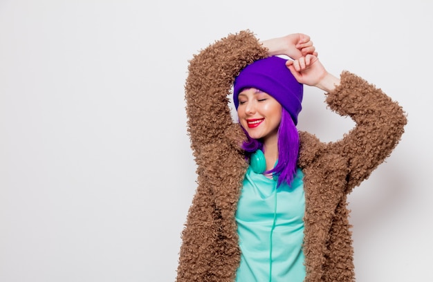 Beautiful young girl with purple hair in jacket