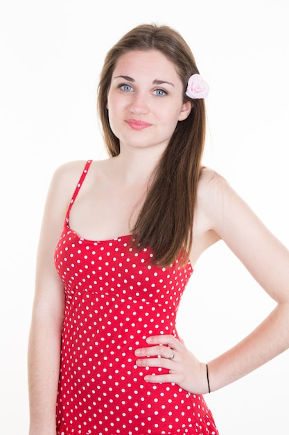 Beautiful young girl with red dress blue eyes