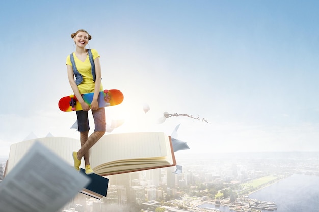 Beautiful young girl with skate board. Mixed media