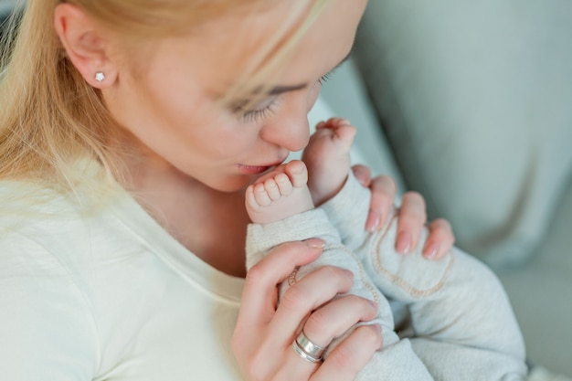 Beautiful young happy mom and baby