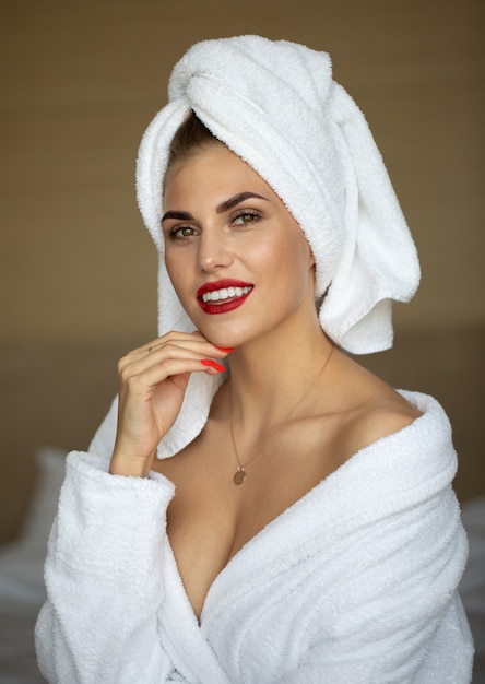 Beautiful young healthy woman relaxing in a robe.