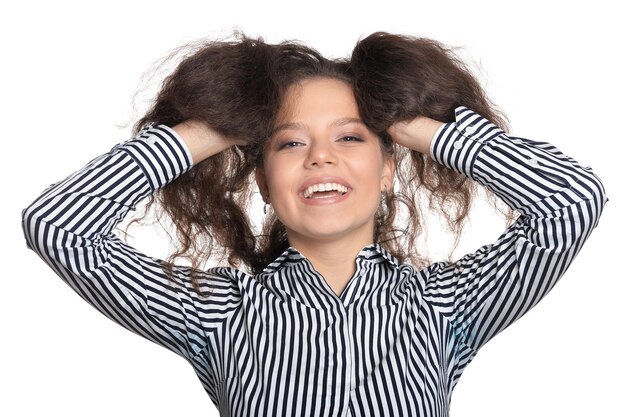 Beautiful young lady posing against white background