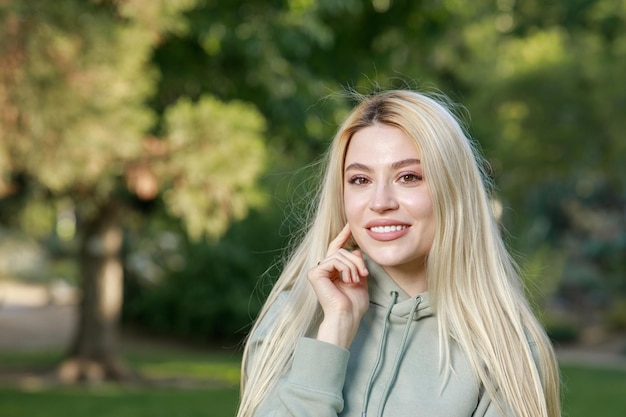 Beautiful young lady smiling to the camera