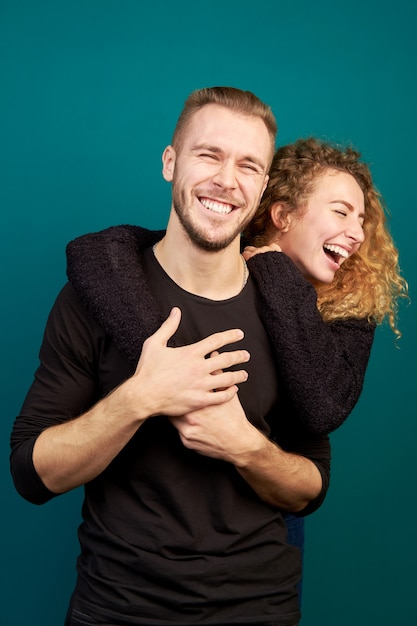 Beautiful young loving couple laughing and hugging, have fun. Family. In relationship.