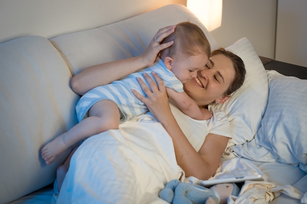 Beautiful young mother is taking care of her toddler