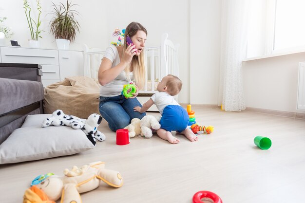 beautiful young mother is taking care of her toddler