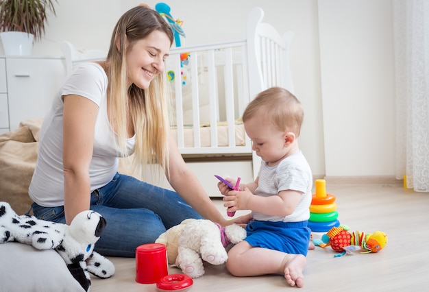 beautiful young mother is taking care of her toddler