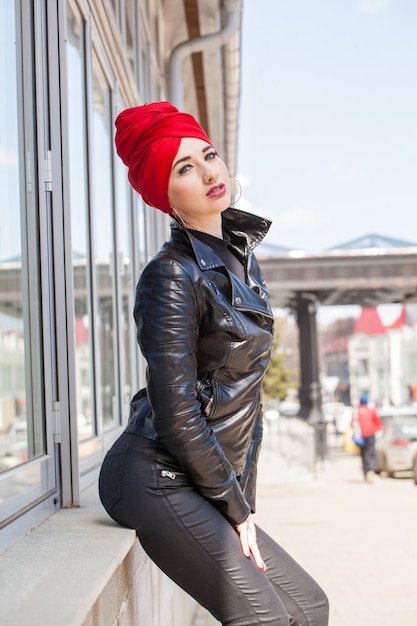 Beautiful young Muslim woman on a walk in the city