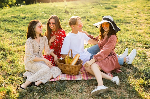 beautiful young people on a summer picnic