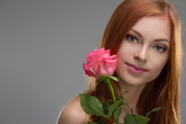 Beautiful young red-haired girl, studio