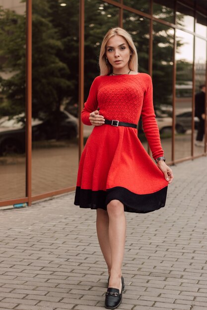 Beautiful young sexy girl in a knitted dress