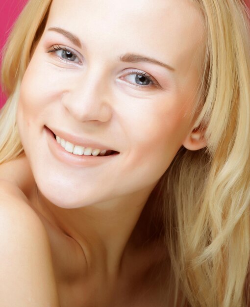 Beautiful young smiling woman with clean skin