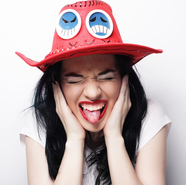 Beautiful young surprised woman. Studio shot.