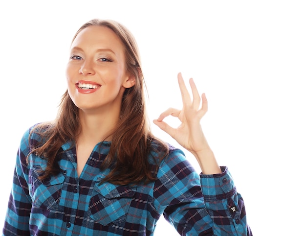 Beautiful young surprised woman. Studio shot.