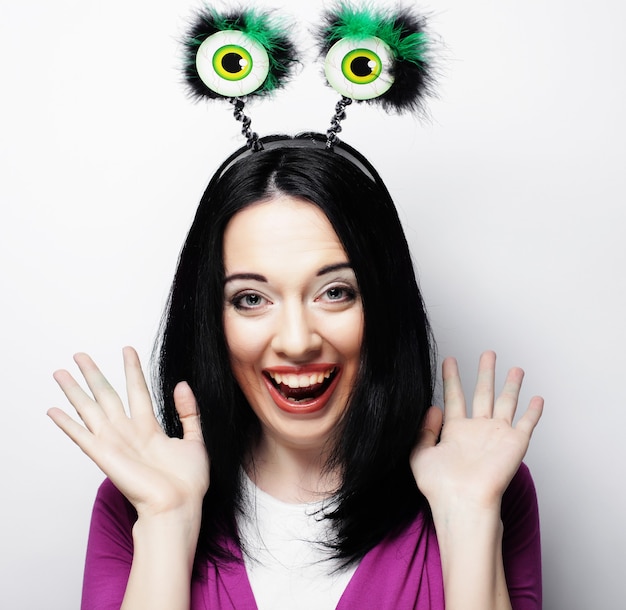 Beautiful young surprised woman. Studio shot.