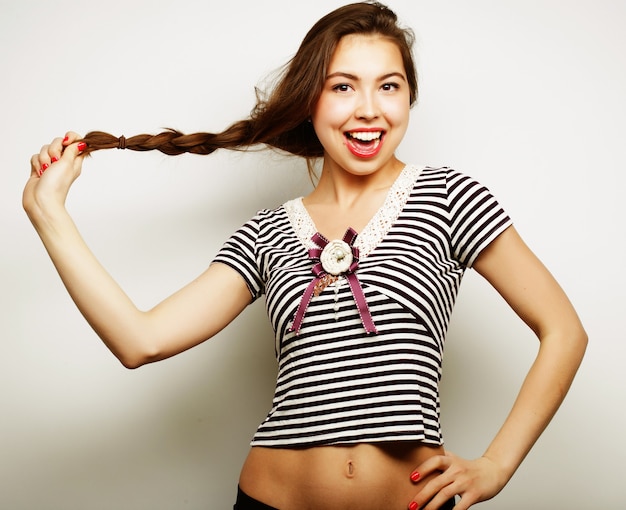 Beautiful young surprised woman. Studio shot.