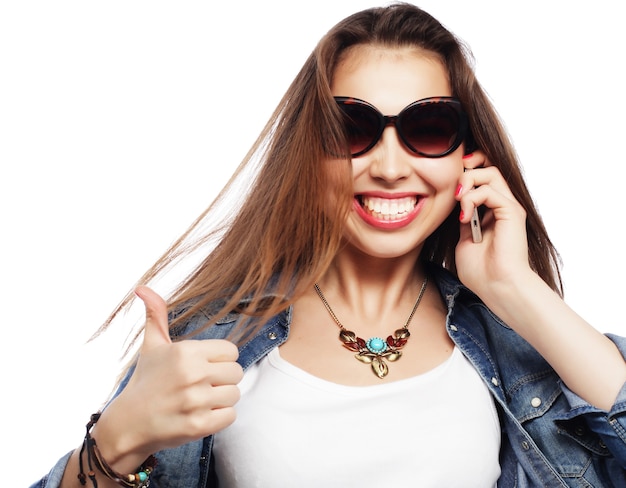 Beautiful young surprised woman. Studio shot.