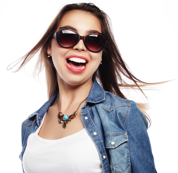 Beautiful young surprised woman. Studio shot.