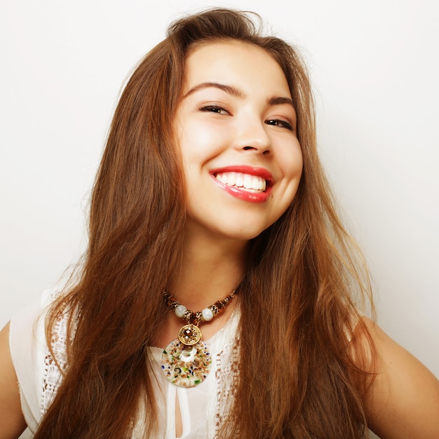 Beautiful young surprised woman. Studio shot.