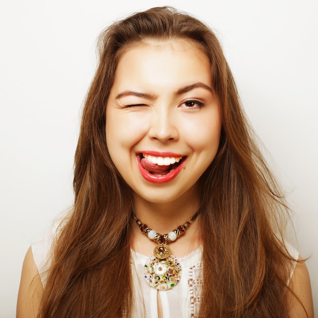 Beautiful young surprised woman. Studio shot.