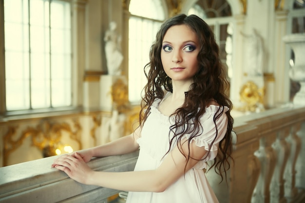 beautiful young victorian lady in white dress