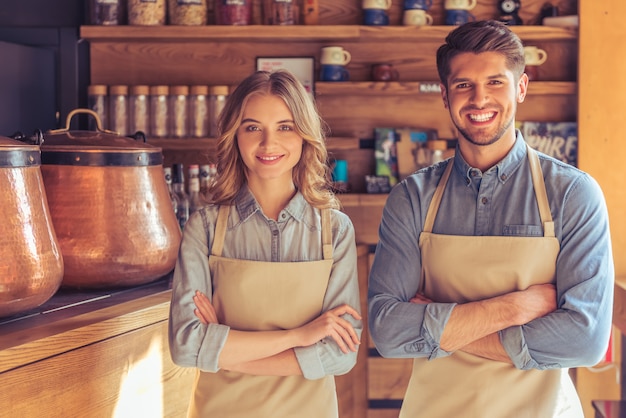 Beautiful young waitress and handsome young waiter.