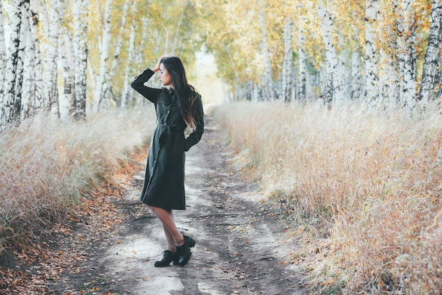 Beautiful young woman in the autumn park