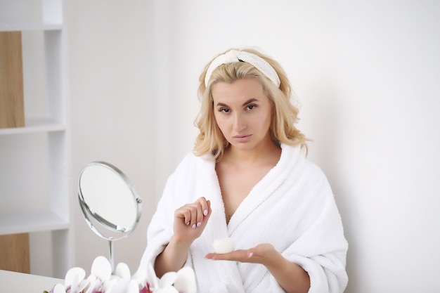 Beautiful young woman in a bathrobe