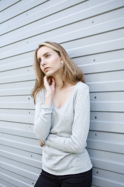 Beautiful young woman in blouse, portrait of cute attractive caucasian model