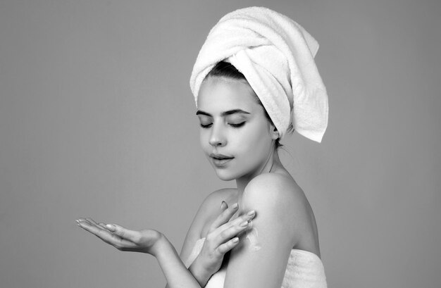 Beautiful young woman care skin facial treatment spa skin care beauty woman wearing hair towel after