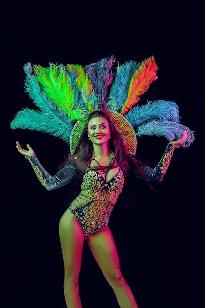 Beautiful young woman in carnival peacock costume Beauty model woman at party