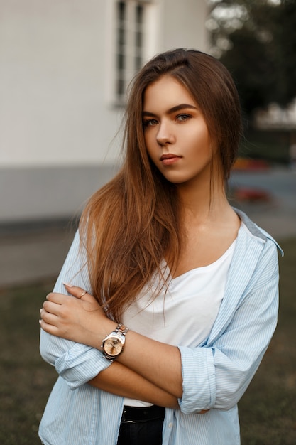 Beautiful young woman in a casual outfit outdoors