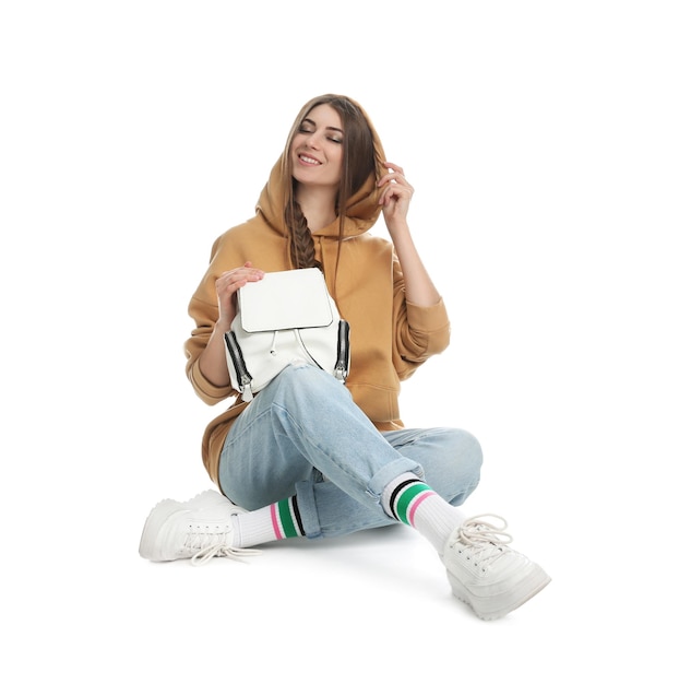 Photo beautiful young woman in casual outfit with stylish bag on white background