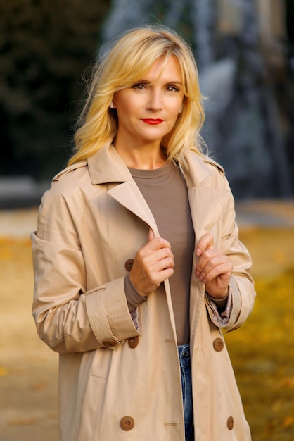 Beautiful young woman in the city in autumn