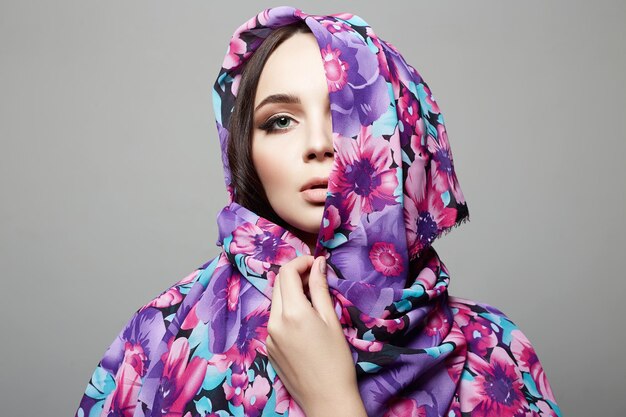 Beautiful young woman in colorful hood