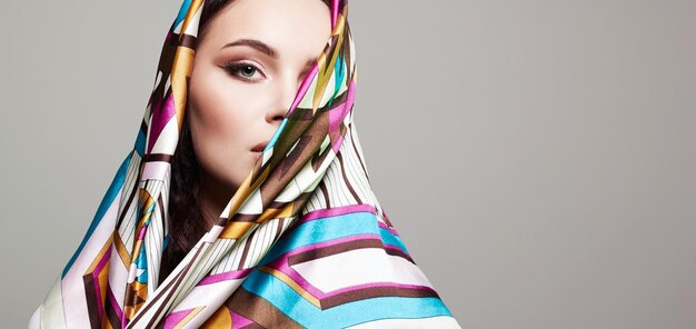 Beautiful young woman in colorful veil beauty girl