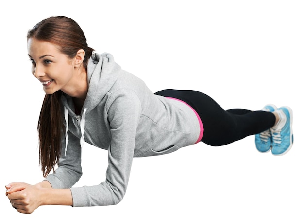 Beautiful young woman doing her workout   isolated white background