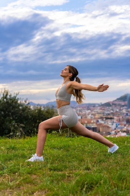 Beautiful young woman exercising nature