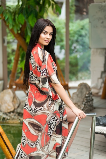 A beautiful young woman in a fashionable beach tunic