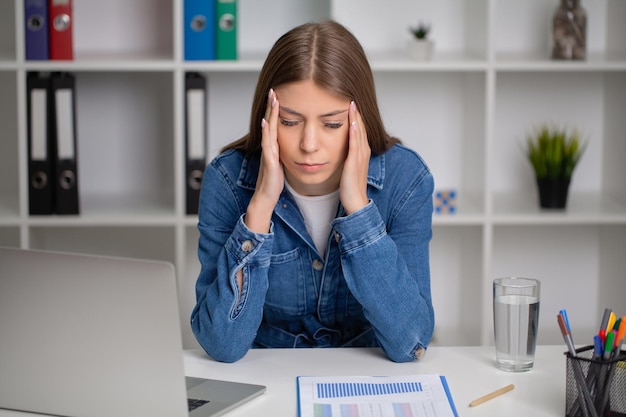 beautiful young woman feeling strong head pain