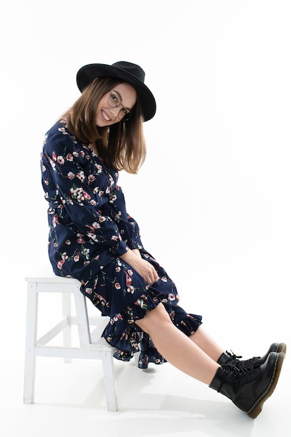 Beautiful young woman in a floral dress