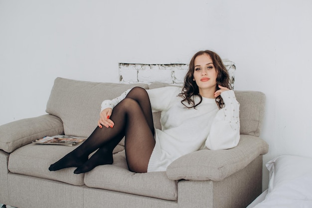 Beautiful young woman in a fluffy white sweater