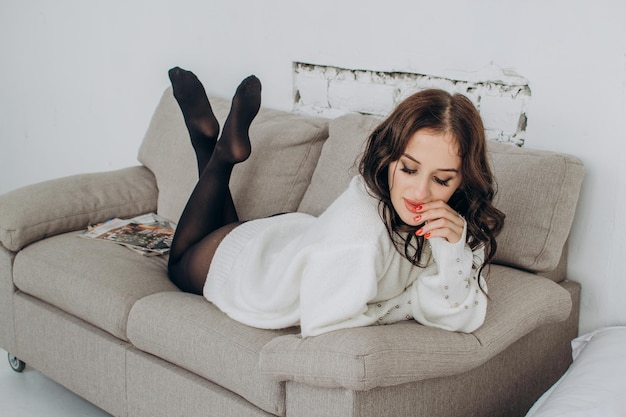 Beautiful young woman in a fluffy white sweater