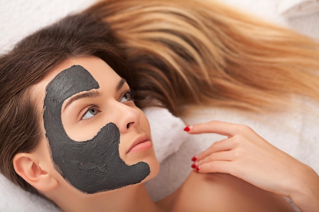 Beautiful Young Woman Getting a Face Treatment at Beauty Salon