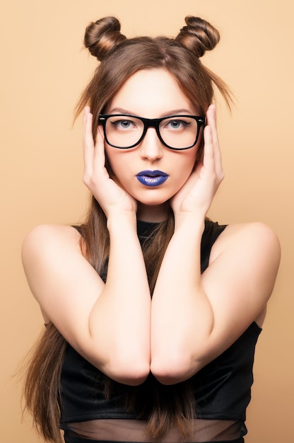 Beautiful young woman in glasses