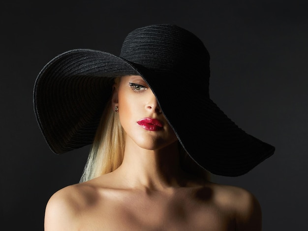 Beautiful young woman in hat