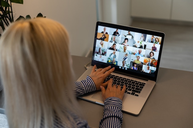 Beautiful young woman having video conference call via computer. Call Meeting. Home office. Stay at home and work from home concept during Coronavirus pandemic