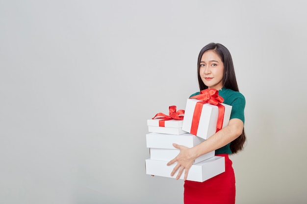 Beautiful young woman holding gifts