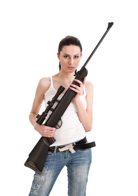 A beautiful young woman holding a sniper rifle isolation on a white background